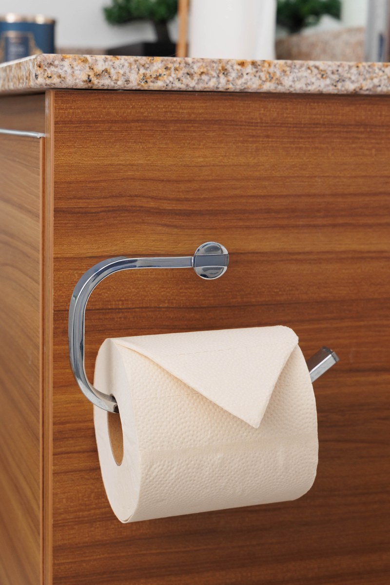 Unbleached bamboo toilet paper roll on a bathroom holder